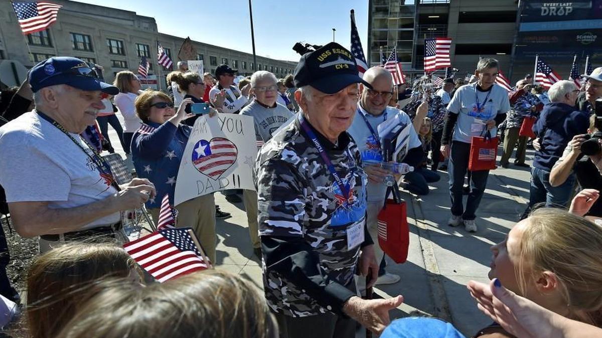 
During a flightless honor flight Sunday at Union Station, area war veterans, including David Maxey (middle) of Lee’s Summit, got a hero’s welcome home by an enthusiastic crowd. Maxey served in the Navy during the Korean war. The event, which was sponsored by Honor Flight Kansas City, helped thank and honor those veterans who are unable to fly to Washington D.C. to visit the war memorials there.
