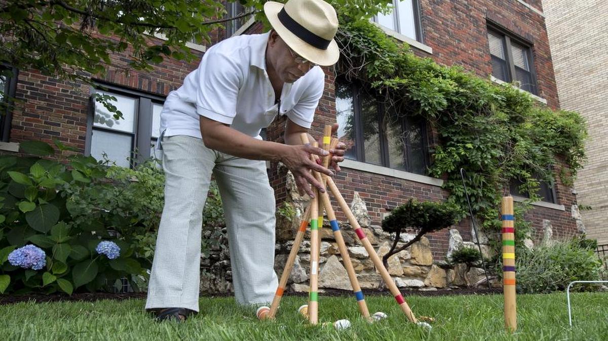 
 Donovan Mouton set up a small croquet court for a lawn party at the Vanity Fair building on the Country Club Plaza. The event was to celebrate architect Nelle Peters and to lobby to save several Plaza buildings she designed from destruction.
