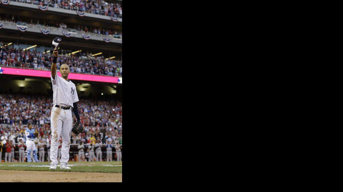 
American League shortstop Derek Jeter, of the New York Yankees, waves as he is taken out of the game in the top of the fourth inning of the MLB All-Star baseball game, Tuesday, July 15, 2014, in Minneapolis.
