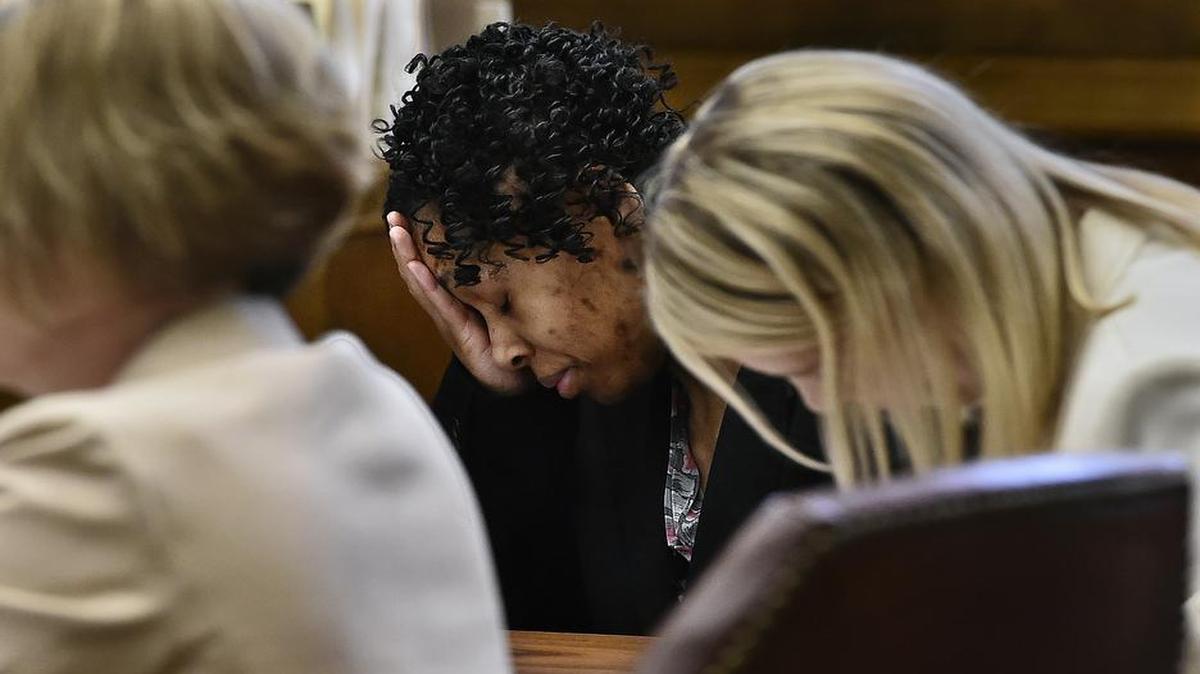 Jacole Prince, the mother of LP, a 10-year-old girl discovered locked in a closet surrounded by her own waste who weighed 32 pounds at the time, appeared in Jackson County Circuit Court Monday, Nov. 16, 2015. Flanked by Jackson County Prosecutor Jean Peters Baker (left) and Missouri Public Defender Caitlin Stephenson, Prince (center), momentarily puts her head in her hand while listening to witness testimony.
