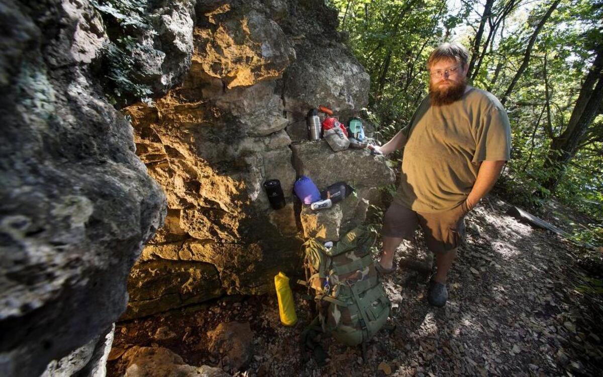 
Mark Rinke of Olathe keeps a “bug-out” bag in case a calamity necessitates a sudden need to get away. The bag has a sleeping bag, cooking utensils, light sticks, a compass, flashlights, a knife, a water bottle and food.
