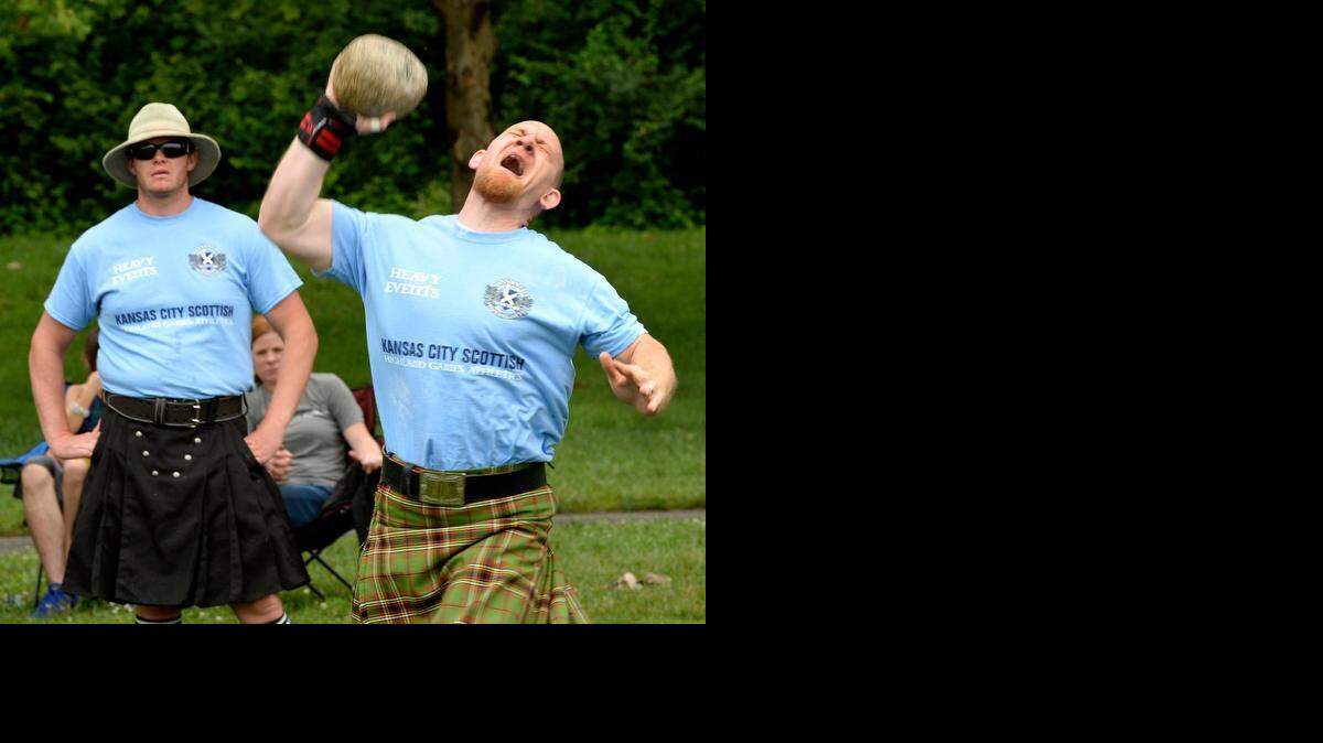 
It started out a little soggy Sunday, but the annual Scottish Highland Games continued at E.H. Young Park in Riverside. Devin Gradwell of Beloit, Kan., heaved a stone for distance during one of the competitions as Jacob Hadkett, also of Beloit, watched.
