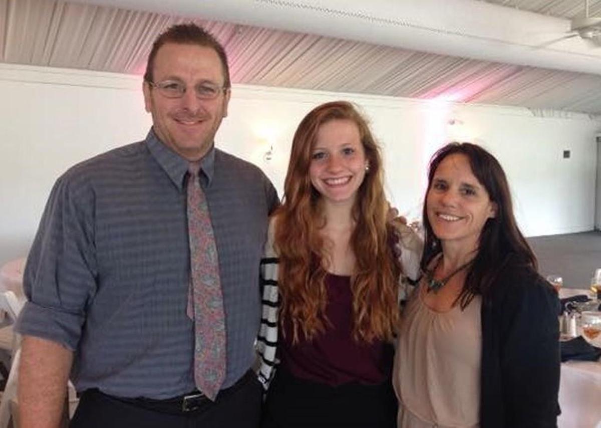 Brianna Luft (center) with her parents, Brandon and Lisa Luft.