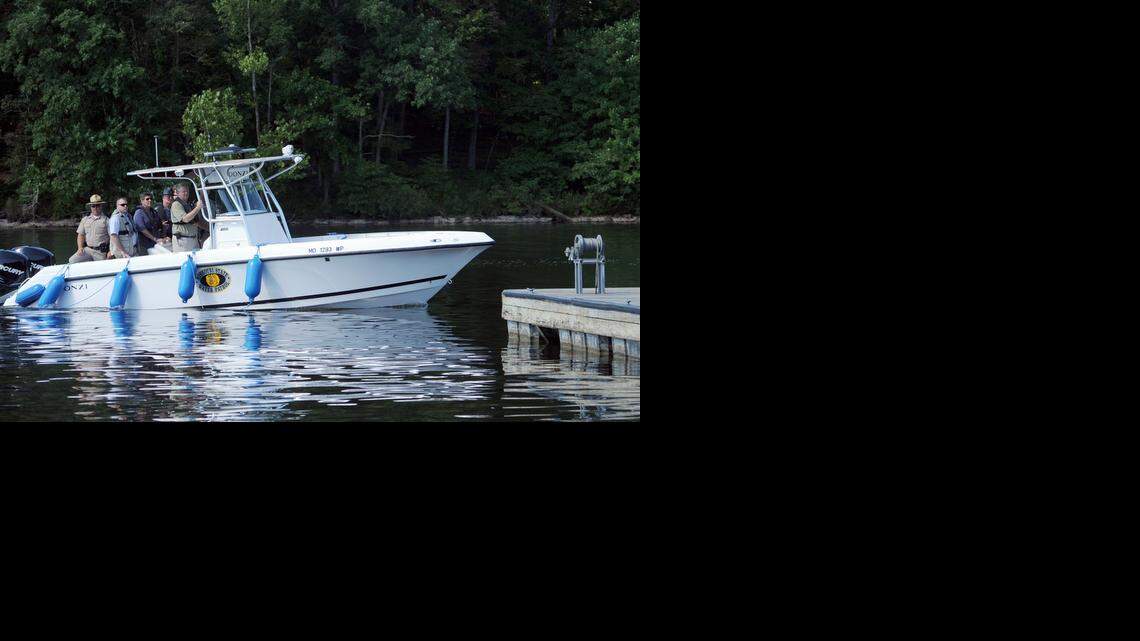 “The unification of the Water Patrol and the Highway Patrol really is about rethinking the way state government works to make it more efficient, more responsive and more responsible to the taxpayers of Missouri,” Gov. Jay Nixon (right, holding bar) said in June 2010. But Water Patrol authorities had concerns.