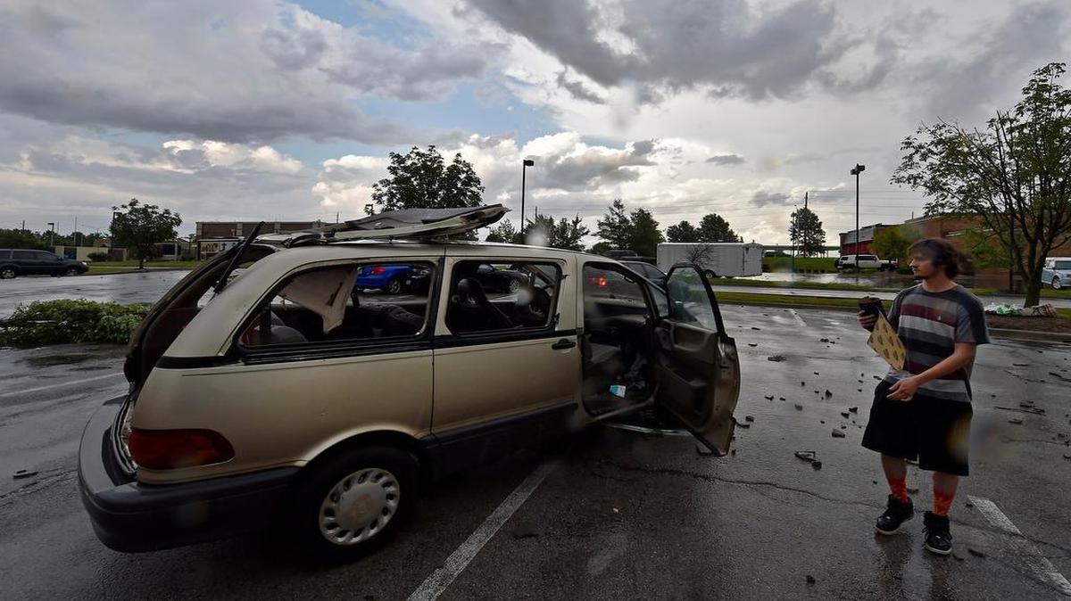 
After Wednesday evening’s severe weather moved through Lee's Summit, Kevin Kern of Kansas City sorted through what was left of the belongings in his van, whose back hatch ripped off and curled onto the roof of his vehicle. Kern was shopping at a strip mall when the sirens sounded.

