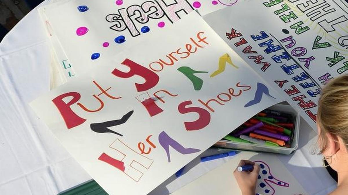 
Sarah Gifford made posters recently for the Walk a Mile in Her Shoes march against sexual assault and gender violence at UMKC.
