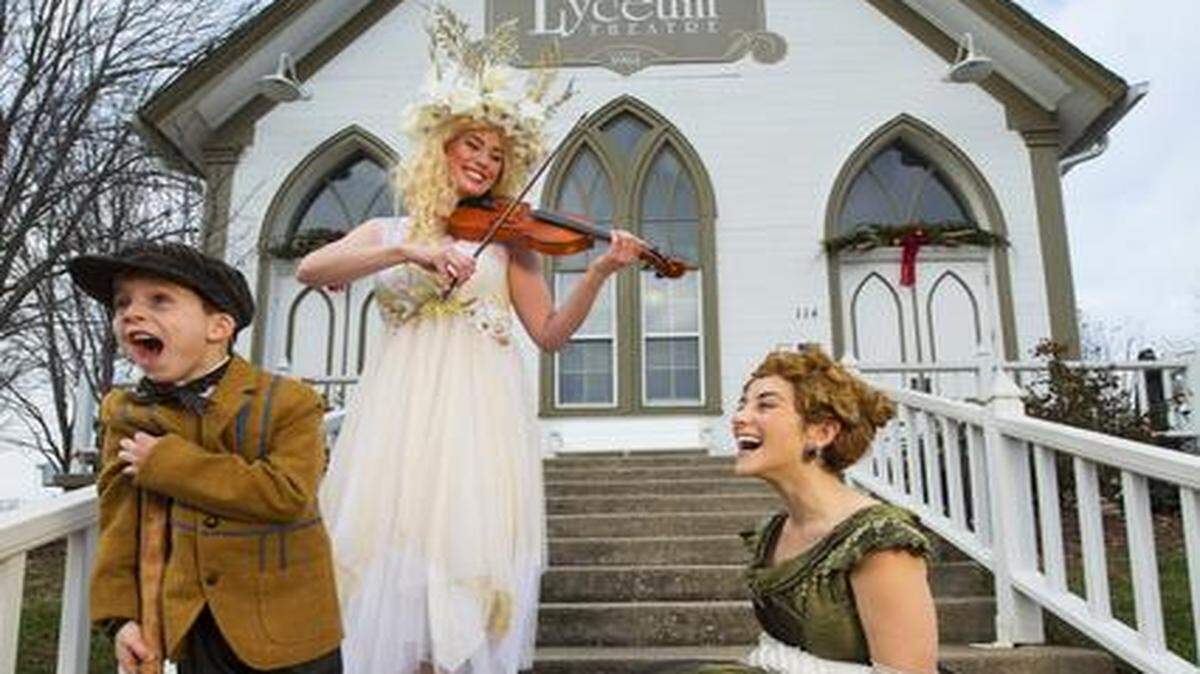 
Cooper Rainwater, 6, of Columbia, is playing Tiny Tim in the Lyceum Theatre’s production of “A Christmas Carol.” Laura Sexauer of St. Louis plays the Ghost of Christmas Past. Dakota Mackey-McGee of New York plays Anne. They were dressed up Friday for the opening night of the show, which has attracted many out-of-town actors. 
