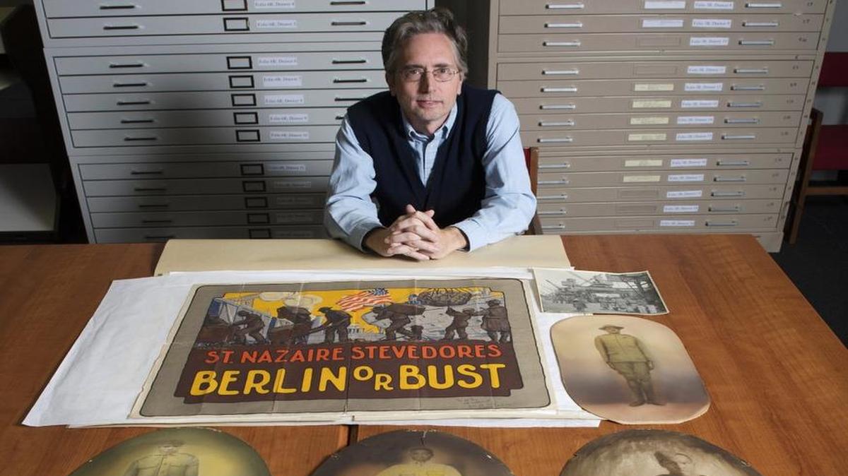 Jonathan Casey, archivist for the National World War I Museum and Memorial and manager of the Edward Jones Research Center, displayed some of the recently donated photographs of African-American soldiers taken during World War I. These images will be on display to the public with the Black Archives of Mid-America on Nov. 7 as a joint effort for the public to help provide any information on these images. The goal is also to determine if more images like these are in the community.