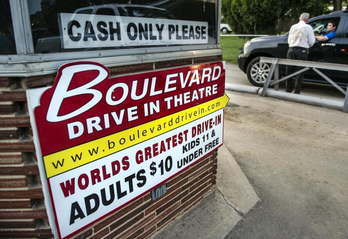 Drivers begin arriving on Saturday, July 11, 2015, at the Boulevard Drive-in, 1051 Merriam Lane, in Kansas City, Kan. Sixty-five years after opening the theater, owner Wes Neal, 87, continues to take tickets and roam the grounds, but he has handed over most the business to his grandson, Brian Neal.
