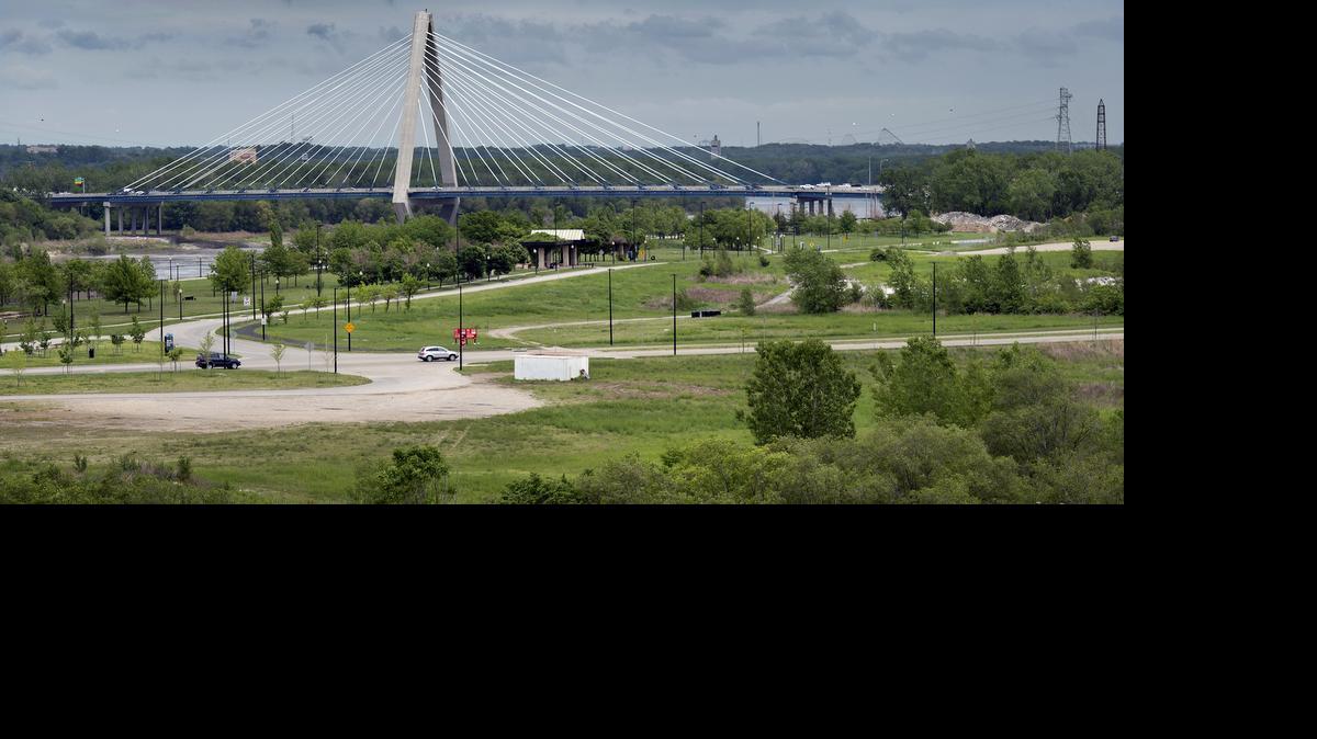 
Port KC, formerly know as the Port Authority of Kansas City, is ready to start work on a mixed-use "urban village" on land adjacent to Berkley Riverfront Park. The development will be built on the land between Front Street where two cars are driving and the road running along the park (left).
