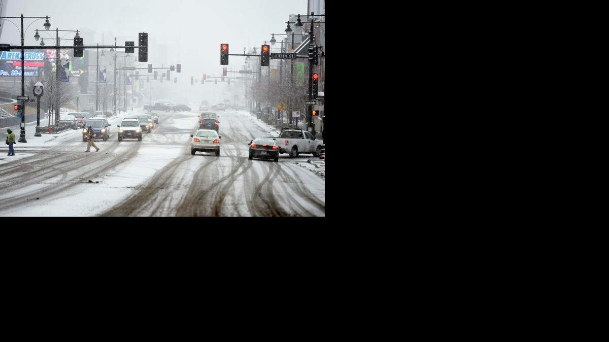 
Snow falls on Grand Blvd. near 13th St. in downtown Kansas City Wednesday afternoon.
