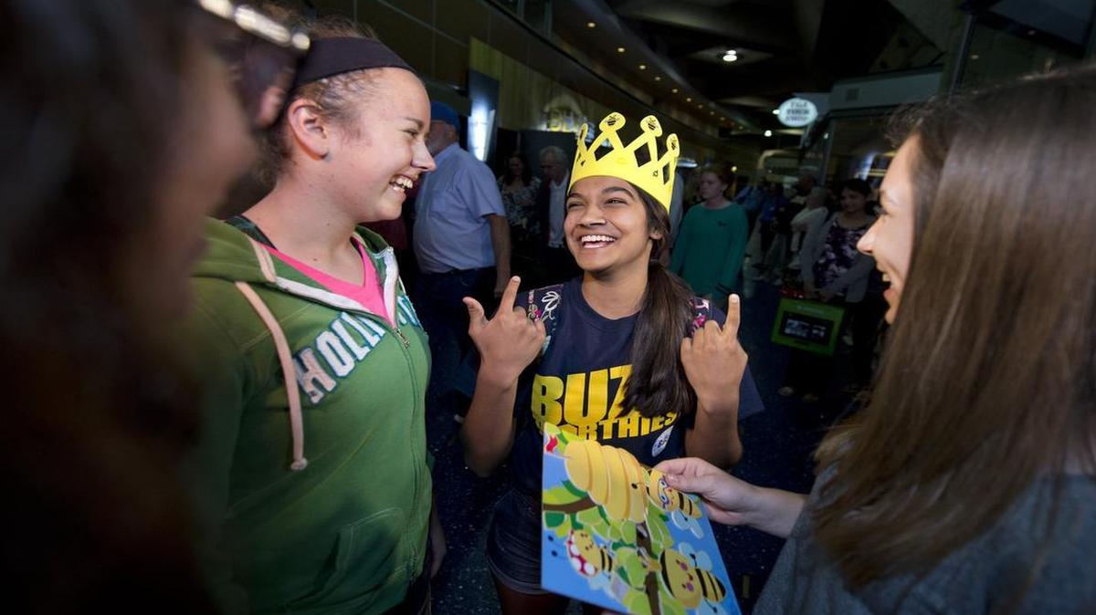 
Co-champion of the Scripps National Spelling Bee, Vanya Shivashankar, 13, of Olathe, laughed at the crown that friends gave her as she arrived Wednesday night at Kansas City International Airport. Included in the greeting party were Aly Shirley (from far left), Kathryn Fenton and Katie Willard.
