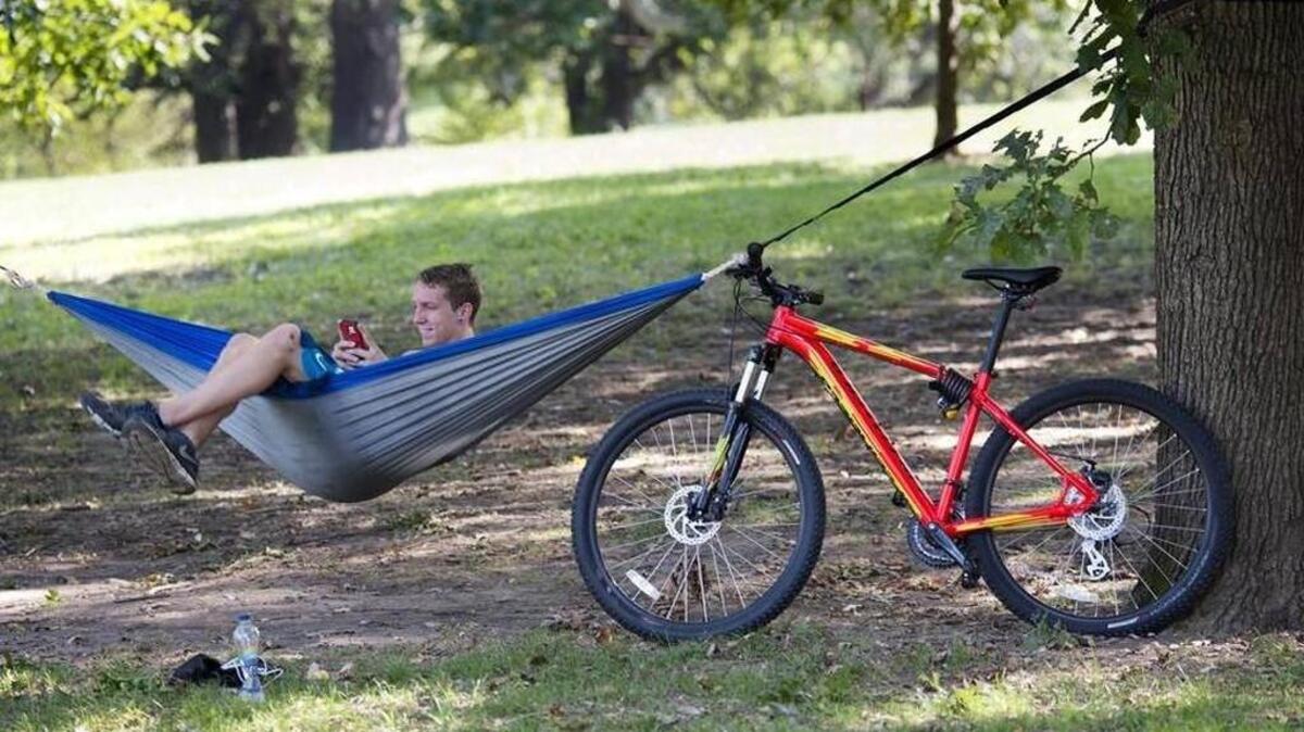 
Derrick Miller of Kansas City, Missouri, took a break from riding his bike Monday to relax at the Jacob L. Loose Park. “Not too many days left like this one, so I thought I would enjoy it,” said Miller
