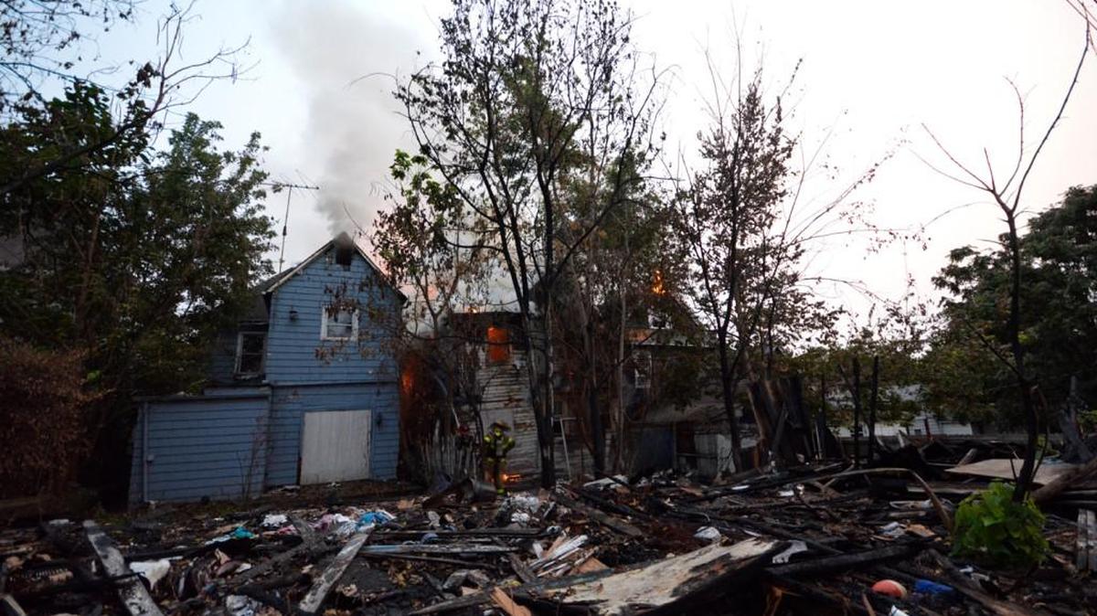 Fire consumed three houses — two abandoned — on Orville Avenue in downtown Kansas City, Kan., Monday evening.