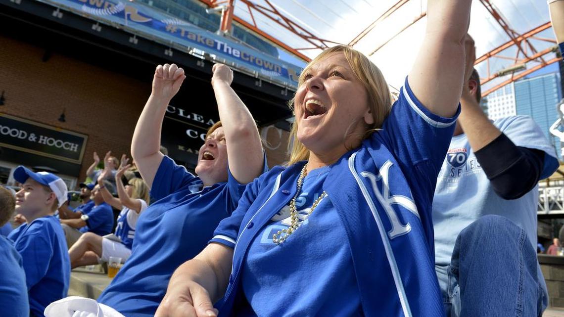 
Cindy Layton (foreground) and her sister, Missy Layton, both of Blue Springs, were among among the fans at the Power & Light District Monday that reacted as the Royals began to come back against the Astros in the final innings of game 4 of the ALDS. On brink of elimination, the Royals stunned the Astros with a 9-6 win. The Layton sisters were not only celebrating the Royals' win, but a combined birthday on Wednesday when Cindy turns 42 and Missy 39.
