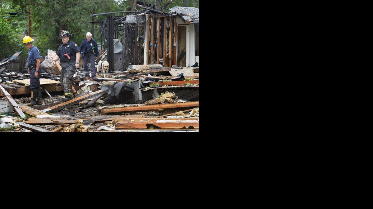 
at the scene of a house explosion at 7704 E. 113th St., in Kansas City.
