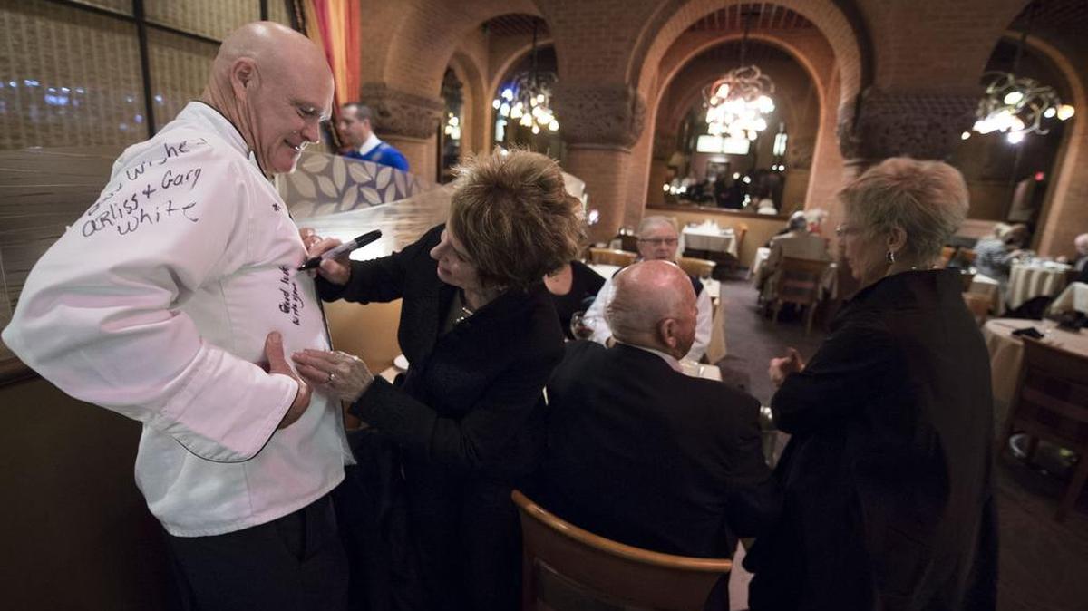 Steph Chatman of Lee’s Summit signed former EBT manager Ed Holland’s chef’s jacket on the restaurant’s last night. Longtime patrons flocked to dine there one last time.