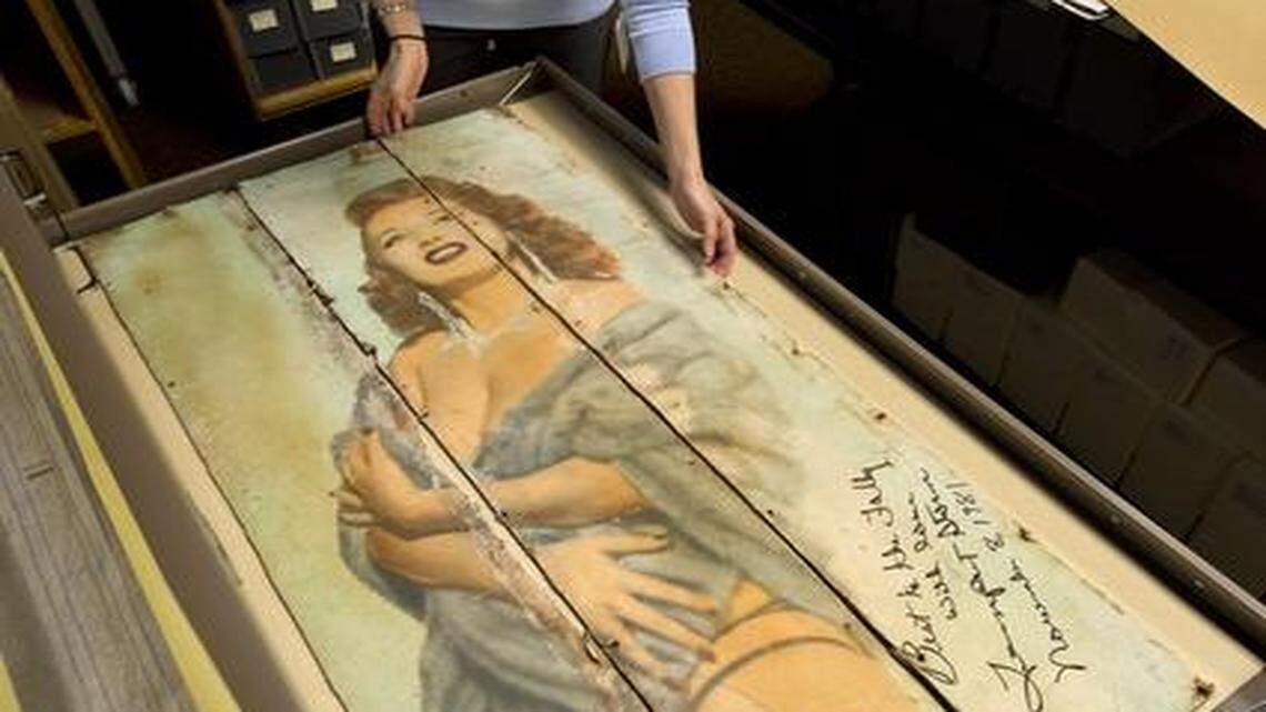 
The Folly Theater has donated posters, autographed photos, contracts and other items from its 114-year history to the Kansas City Public Library. Last week, archivist Kate Hill inspected a poster of striptease artist Tempest Storm, who signed the artifact when she came to Kansas City in 1981 for the Folly’s reopening celebration.
