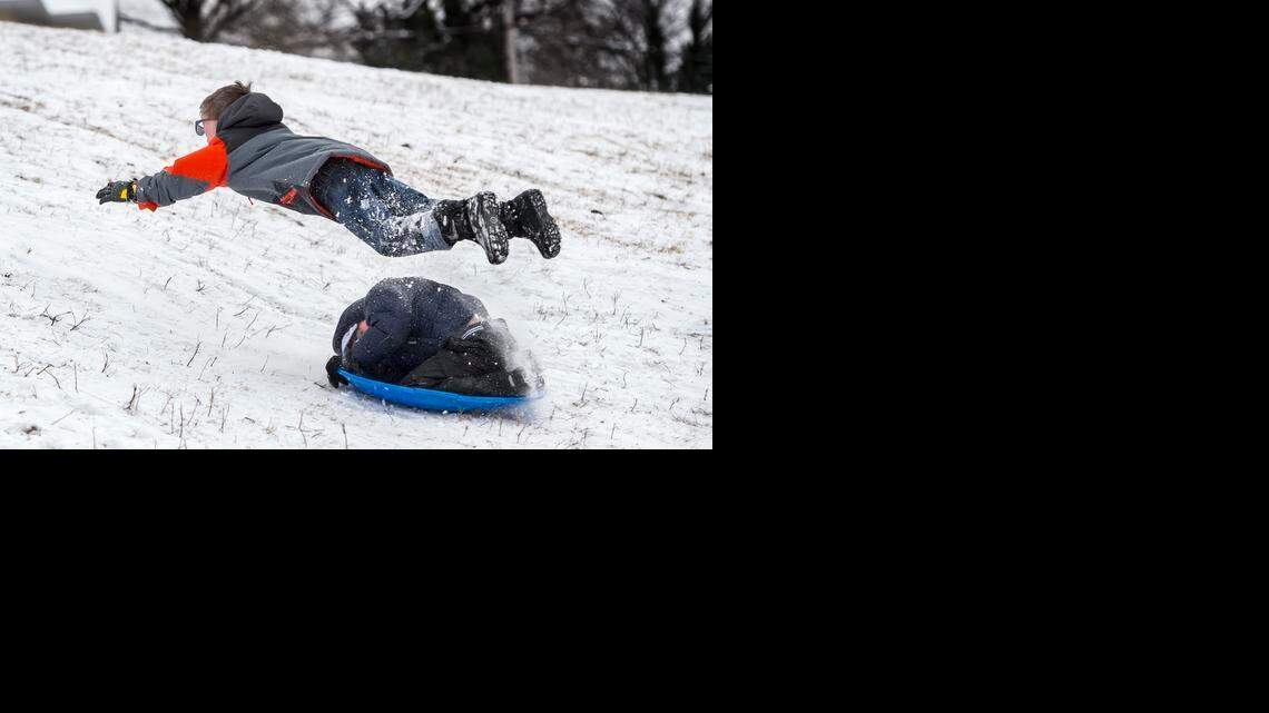 
Jeremy Smith, 6, of Kansas City, Mo, flew into the air after being struck by a sledder sliding down a steep hill in Brookside Park on Monday afternoon. Jeremy left crying but walked away from the accident and was comforted by his uncle, Jed Smith. Sledding safety is at the core of several cities nationwide that have banned or heavily fined sledders.

