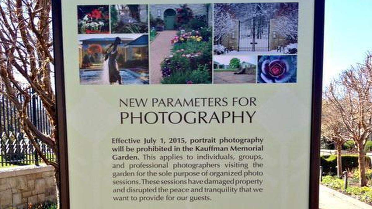 
A sign announcing the new policy banning portrait photography effective July 1 has been posted at the Ewing and Muriel Kauffman Memorial Garden in Kansas City.
