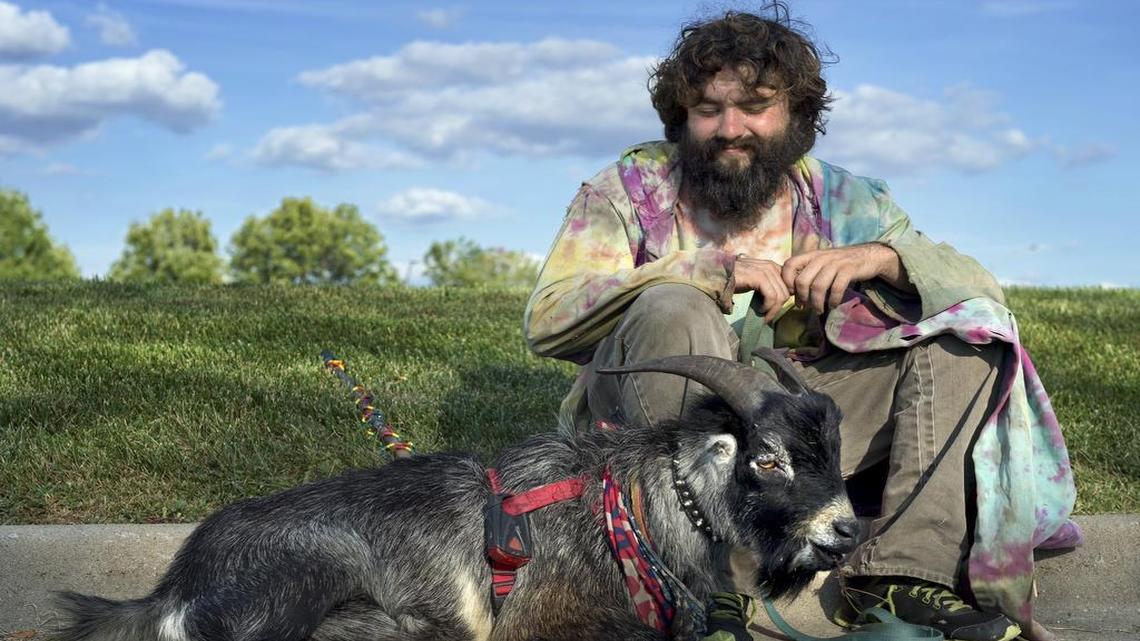 
Since April, Erick Brown and his goat named Deer have been traveling across America; they started out in Florida. In mid-August they were passing through Kansas City, spreading “peace and love” and hoping to inspire people to live their dreams.
