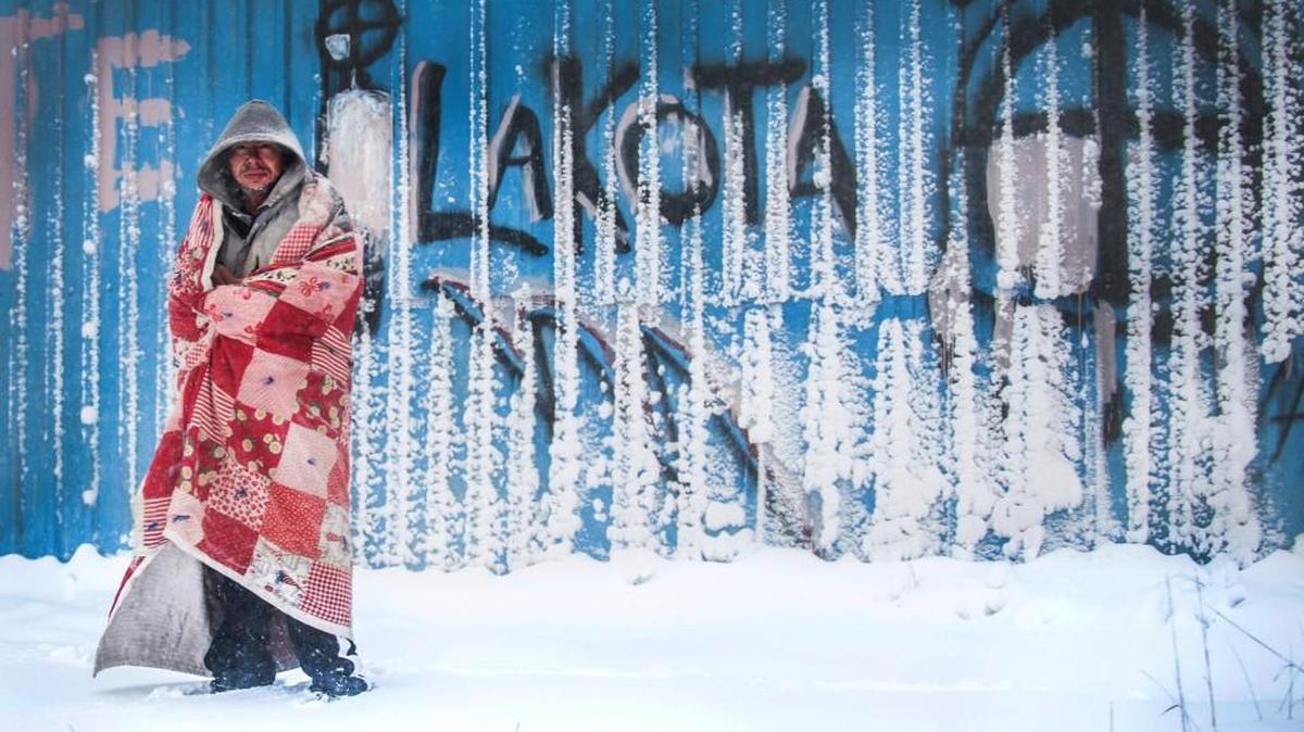 A Lakota man stands in a heavy snowdrift in Whiteclay, Neb. This photo by Jake Crandall, a former Shawnee Mission East student, was part of the award-winning “Wounds of Whiteclay” series that included work from former Shawnee Mission East students