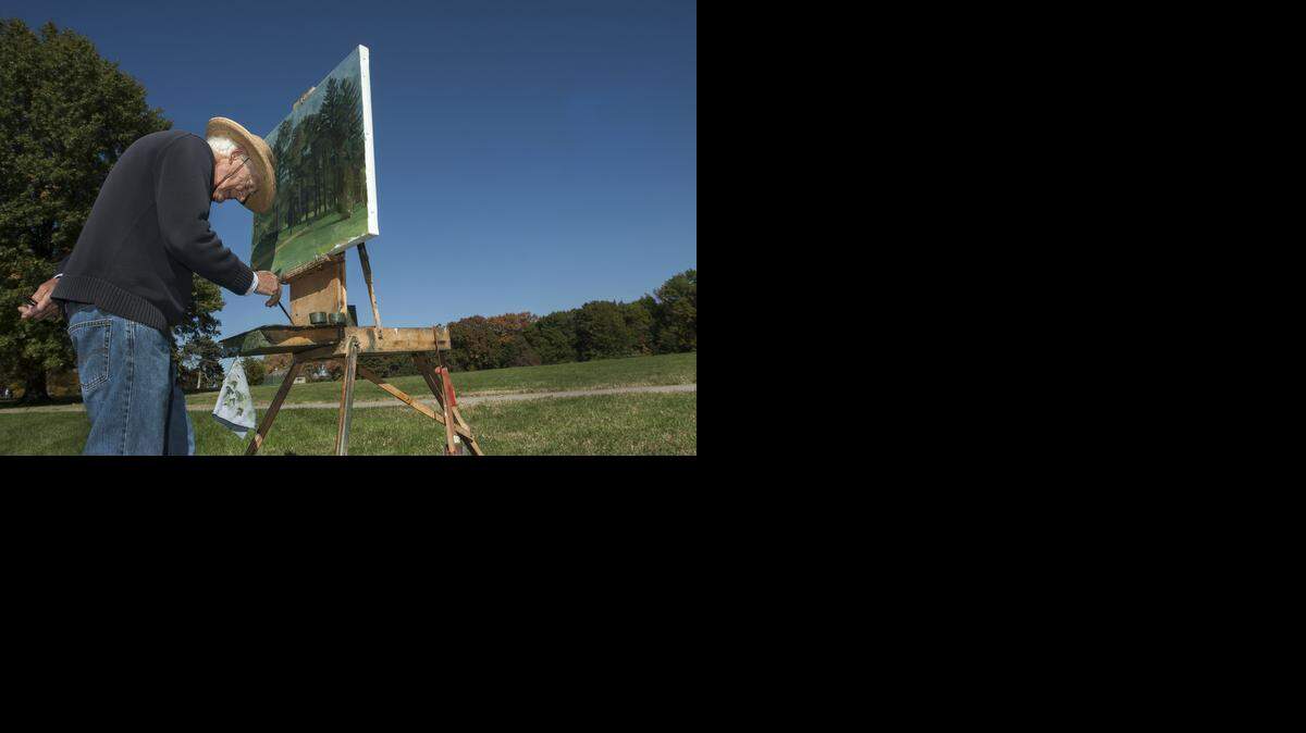 Beloved professor and painter Wilbur Niewald, of Mission, Kansas, died Saturday, April 30, 2022. He was 97. He is pictured working on an oil painting on Tuesday, October 21, 2014, in Loose Park.