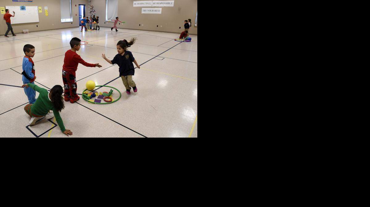 
Kindergartners at the Guadalupe Center campus on the site of the former St. Paul’s School of Theology played recently during their physical education class.
