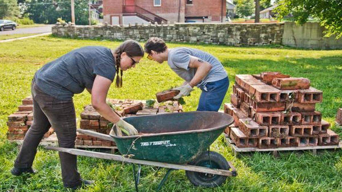 
Sean Starowitz, who is heading up the Lots of Love project, recently worked with Vanessa Eickhoff to collect pallets of bricks that will be used later in the landscaping design for the vacant lot at 3700 Woodland Ave. 
