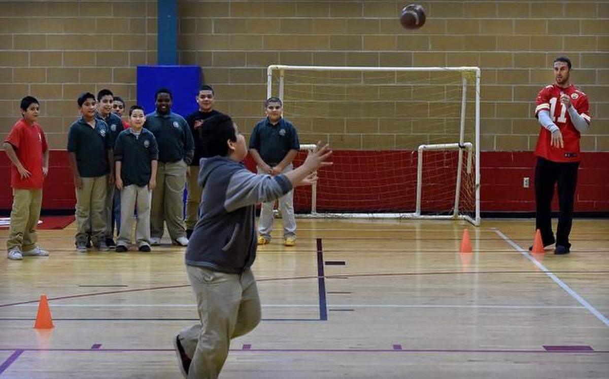 Students from Alta Vista Middle School got a chance to catch passes thrown by Kansas City Chiefs players at the Tony Aguirre Community Center in 2014.