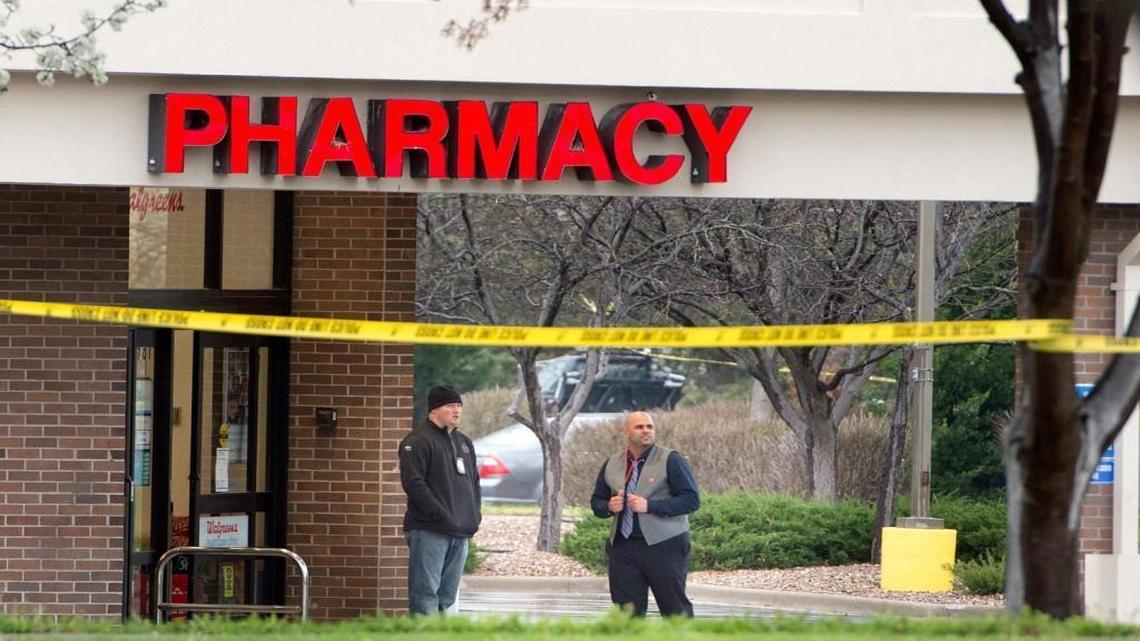 Crime scene tape surrounded a Blue Springs Walgreens where authorities shot a man suspected in a robbery early Thursday.