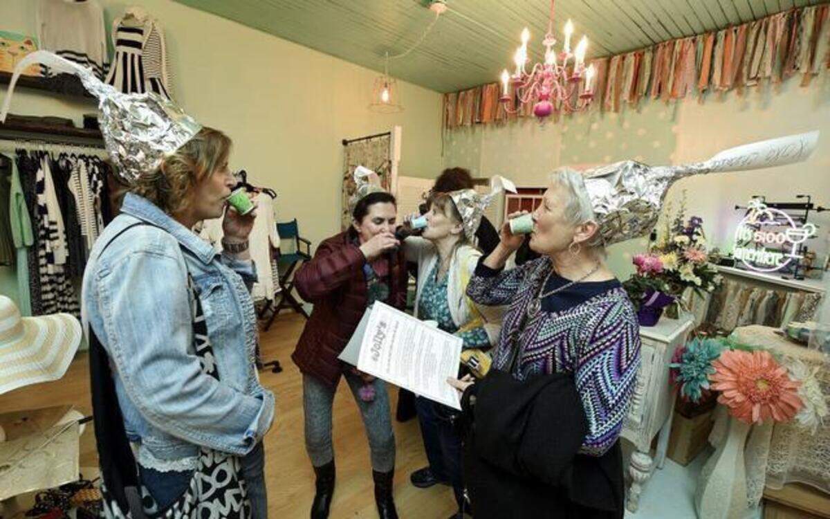 
Calling themselves the Kiss Girls, Kim Litton (from left) of Lee’s Summit, Cheryl Moore of Lee’s Summit, Brenda Keisker of Independence and Glenda Moore of Columbia made Hershey’s Kiss hats in honor of Lee’s Summit’s Chocolate Crawl on Saturday. They sampled a drink at the newly opened @Jolly’s store downtown.
