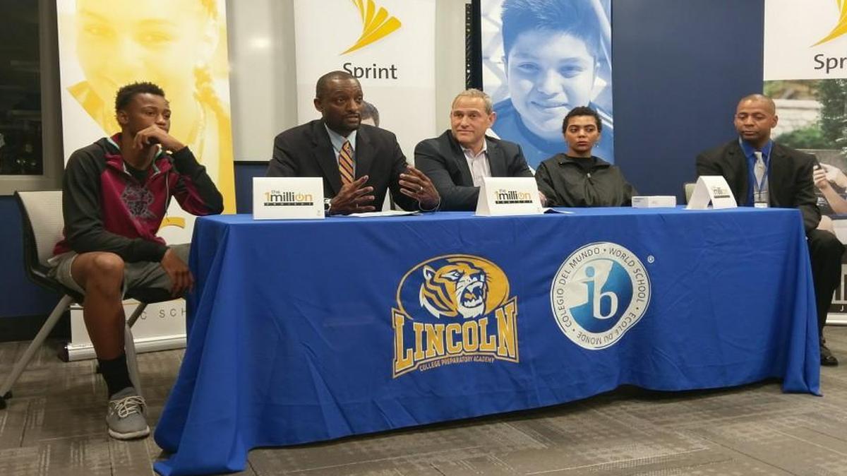 Kansas City Superintendent Mark Bedell (second from left) said Sprint’s 1Million Project would help “close the opportunity gap in the Kansas City Public Schools.” At center is the project’s leader, Sprint’s Doug Michelman. The effort gave home internet access to 500 Kansas City students.
