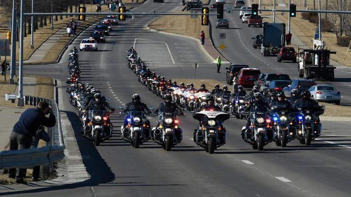 
Law enforcement officers escorted the funeral procession for Olathe Police Officer Michael Kern Tuesday in Olathe. Kern died in the line of duty last week while he prepared his police motorcycle to be part of an escort for President Obama’s visit to Lawrence.
