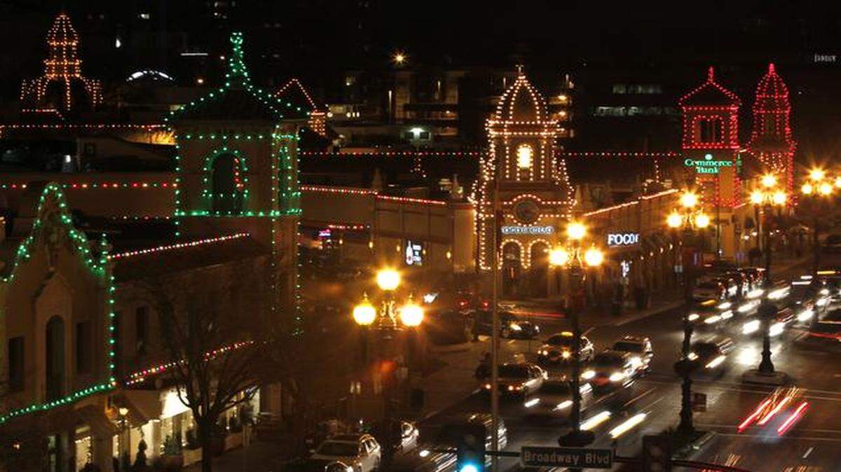 
Motorists looking for parking spots or just driving through added to the light display of the Country Club Plaza lights on a Friday night in 2011. 
