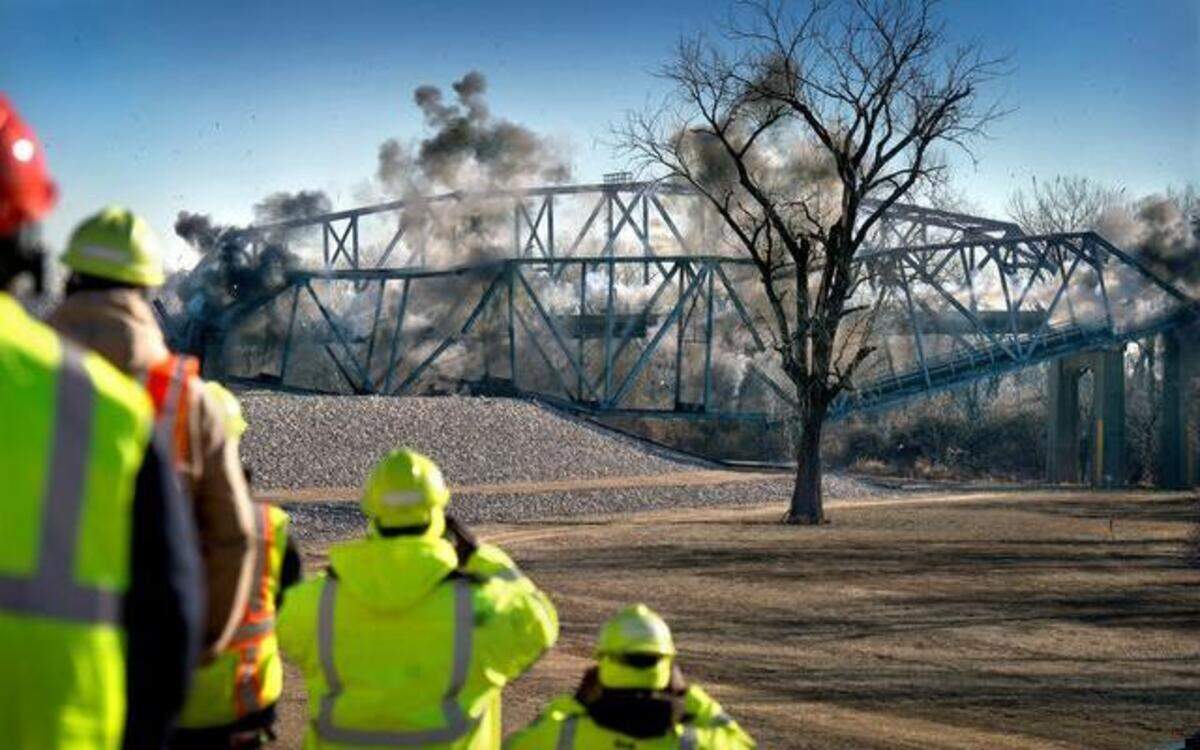
The north and south ends of the Fairfax Bridge carrying U.S. 69 between Riverside and Kansas City, Kan., were brought down by explosives Friday. Workers watched from a safe distance as the 1,300-foot north truss structure came crashing to the ground.
