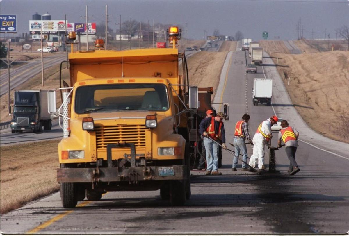 Crews from the Missouri Department of Transportation seal cracks and fill potholes along Interstate 70. A state report finds Missouri state agencies aren’t as ethnically and racially diverse as the state population.