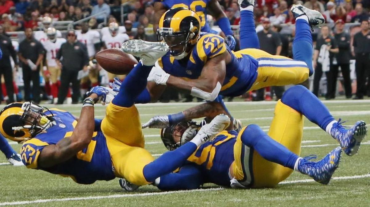 St. Louis Rams’ Rodney McLeod, cornerback Trumaine Johnson (22) and linebacker James Laurinaitis converge on a pass but are unable to make an interception during an NFL football game against the San Francisco 49ers Sunday. (Chris Lee/St. Louis Post-Dispatch via AP)