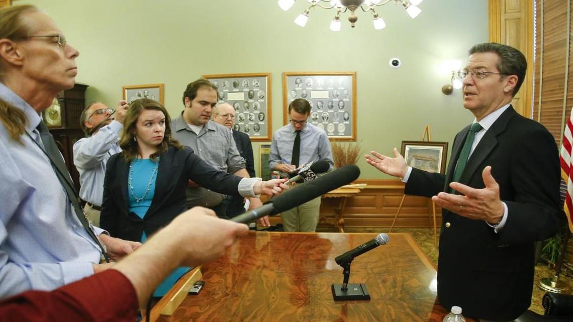 Kansas Gov. Sam Brownback addresses the media on a proposed tax plan that he intends to sign if passed by the House, on Monday June 8, 2015, at the Kansas Statehouse in Topeka, Kan.