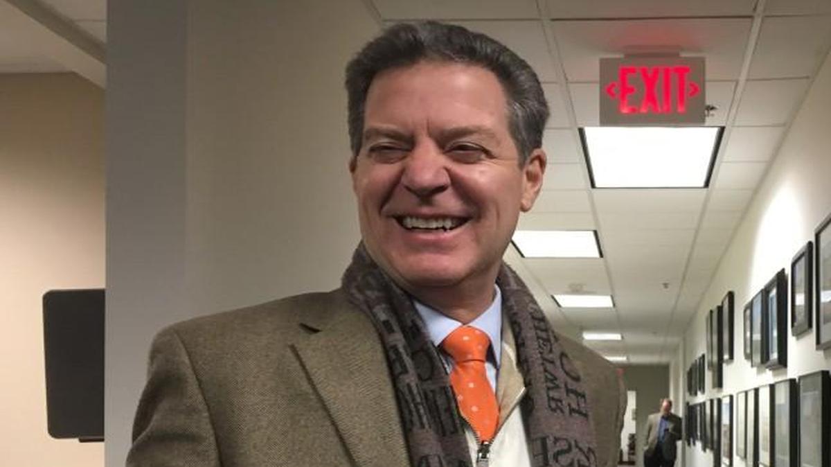 “He absolutely traveled,” Gov. Sam Brownback said Wednesday of the winning shot in KU’s victory over K-State.