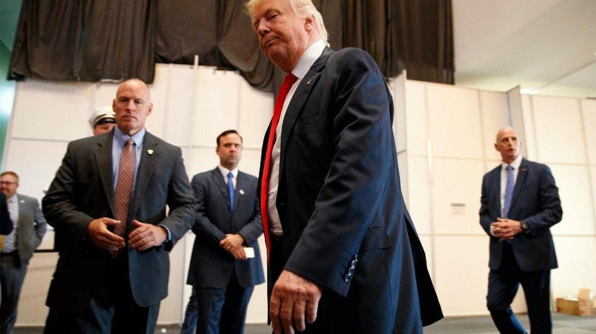 Republican presidential candidate Donald Trump walks away after speaking to reporters before a town hall event, Monday, Aug. 1, 2016, in Columbus, Ohio. (AP Photo/Evan Vucci)