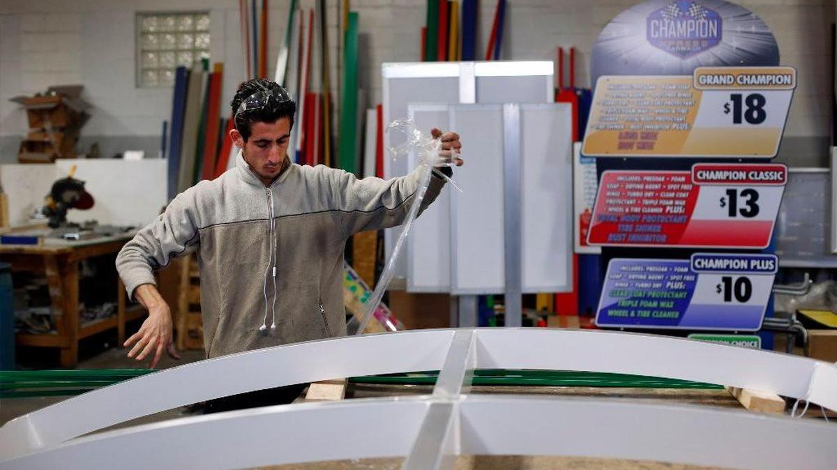 Syria refugee Nedal Al-Hayk works as a fabricator in Warren, Mich. Al-Hayk, who was resettled in suburban Detroit with his family after a three-year wait, said officials interviewed him and his wife in separate rooms, repeatedly asking detailed questions pressing them about their backgrounds and reasons for fleeing Syria. (AP Photo/Paul Sancya, File)
