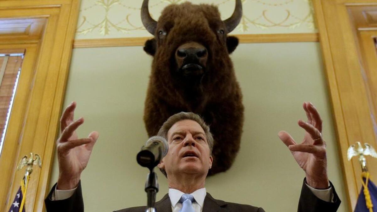 Kansas Gov. Sam Brownback talks to the media during a news conference Thursday, July 27, 2017, in Topeka, Kan. President Donald Trump on Wednesday nominated Brownback to be ambassador-at-large for international religious freedom.