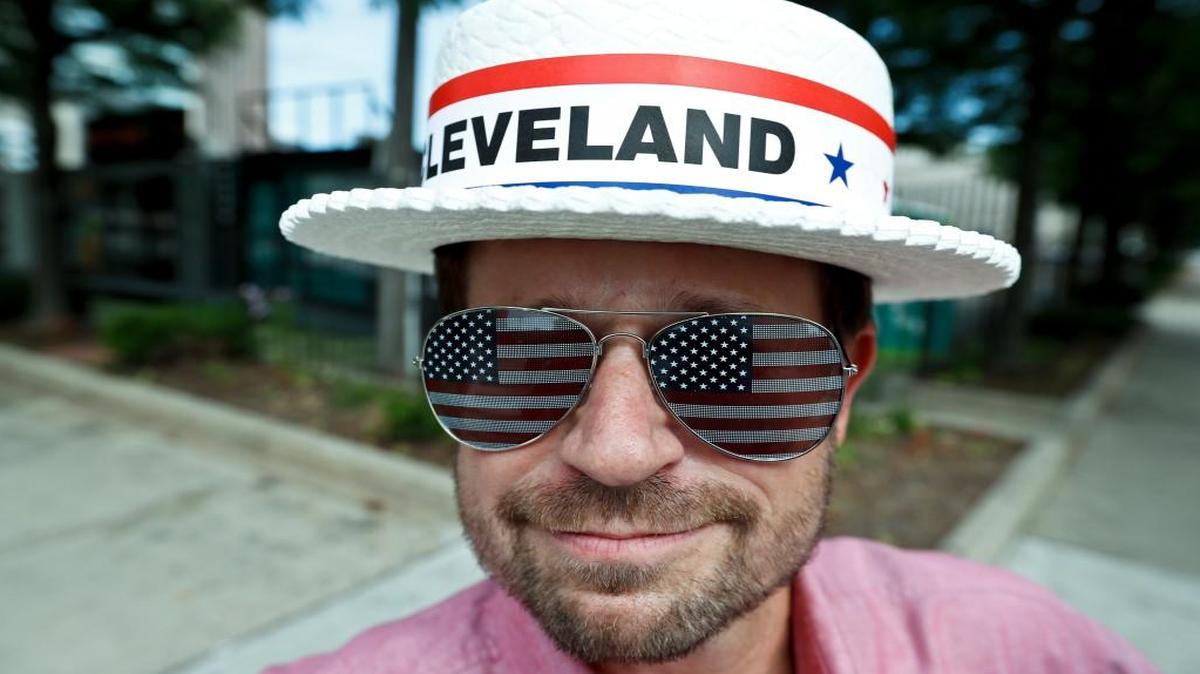 Andy Sandy wore an RNC hat and pair of American flag sunglasses while walking around Sunday in Cleveland. The Republican National Convention starts Monday in the city.