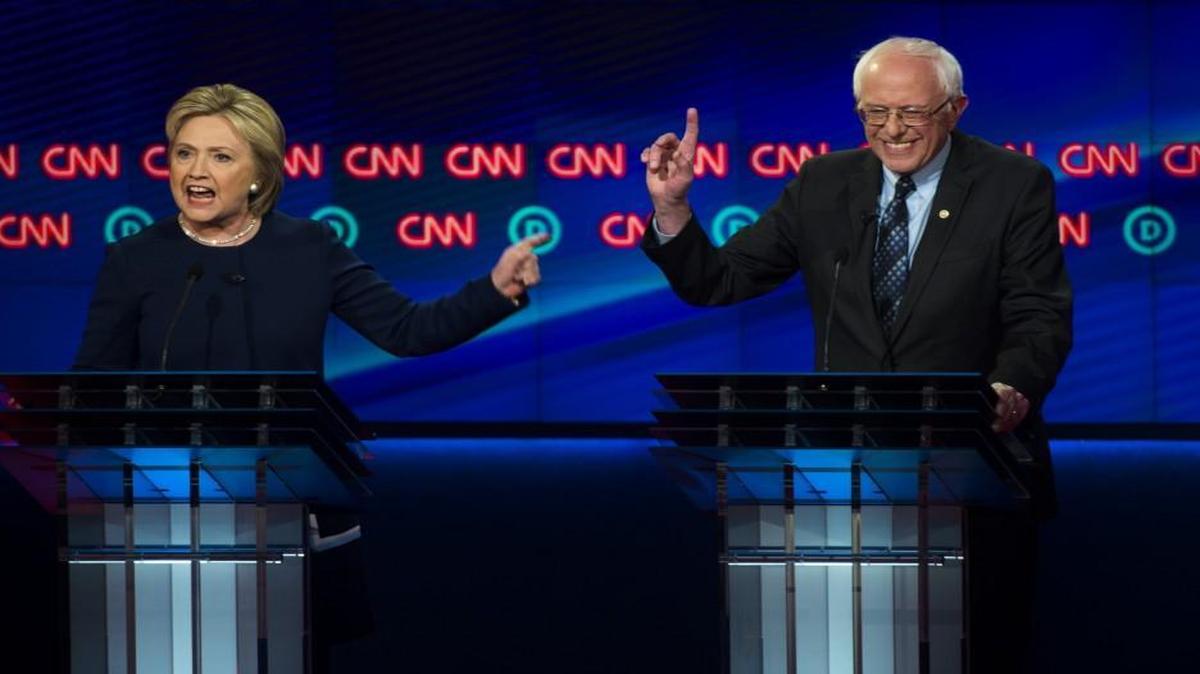 Democratic presidential candidates Hillary Clinton and Sen. Bernie Sanders argue a point during their Sunday night debate.