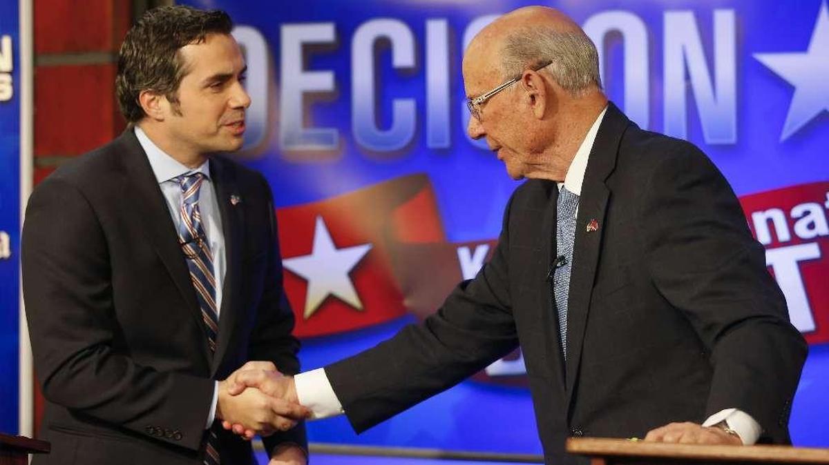 Independent Senate candidate Greg Orman, left, and Sen. Pat Roberts, R-Kan., shake hands after concluding their second debate.