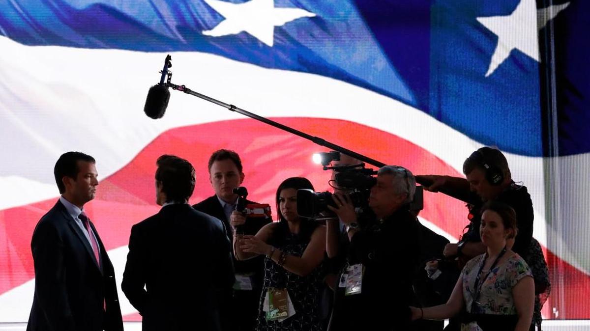 Donald Trump, Jr., son of Republican Presidential Candidate Donald Trump, talks with reporters on the stage of the Republican National Convention in Cleveland on Tuesday.