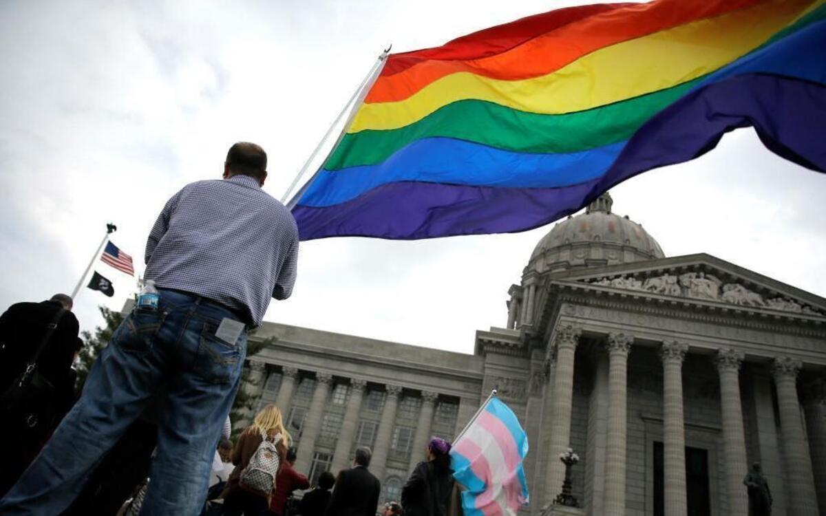 In this March 31 file photo, gay-rights supporters rallied outside the Missouri Capitol in Jefferson City to protest Senate Joint Resolution 39, which would ask voters to amend the Missouri Constitution to protect certain individuals and businesses who cite religious beliefs to refuse service to same-sex couples. Businesses from around Missouri on Tuesday announced the formation of a coalition designed to stop a “religious freedom” amendment to the state’s constitution that’s currently making its way through the legislature.