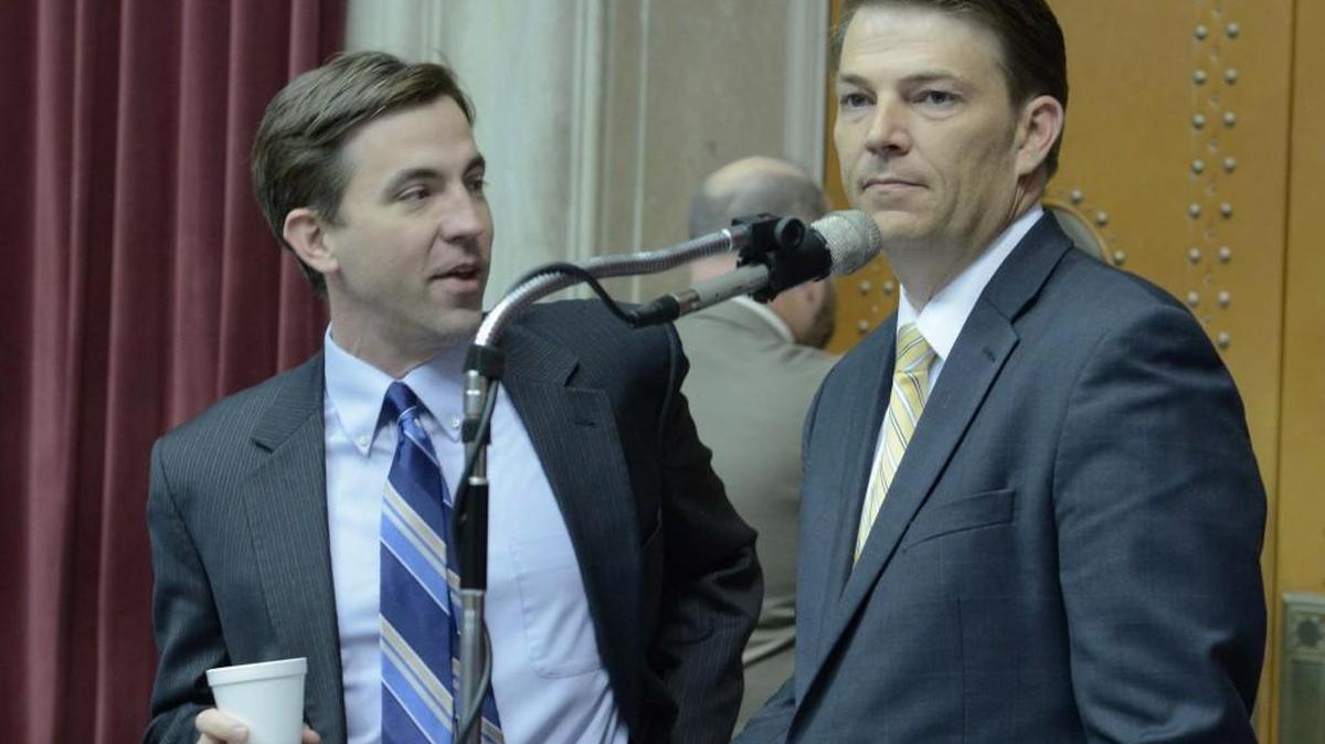Republican Rep. Jay Barnes of Jefferson City (left) talked with House Speaker Todd Richardson on the floor of the Missouri House.