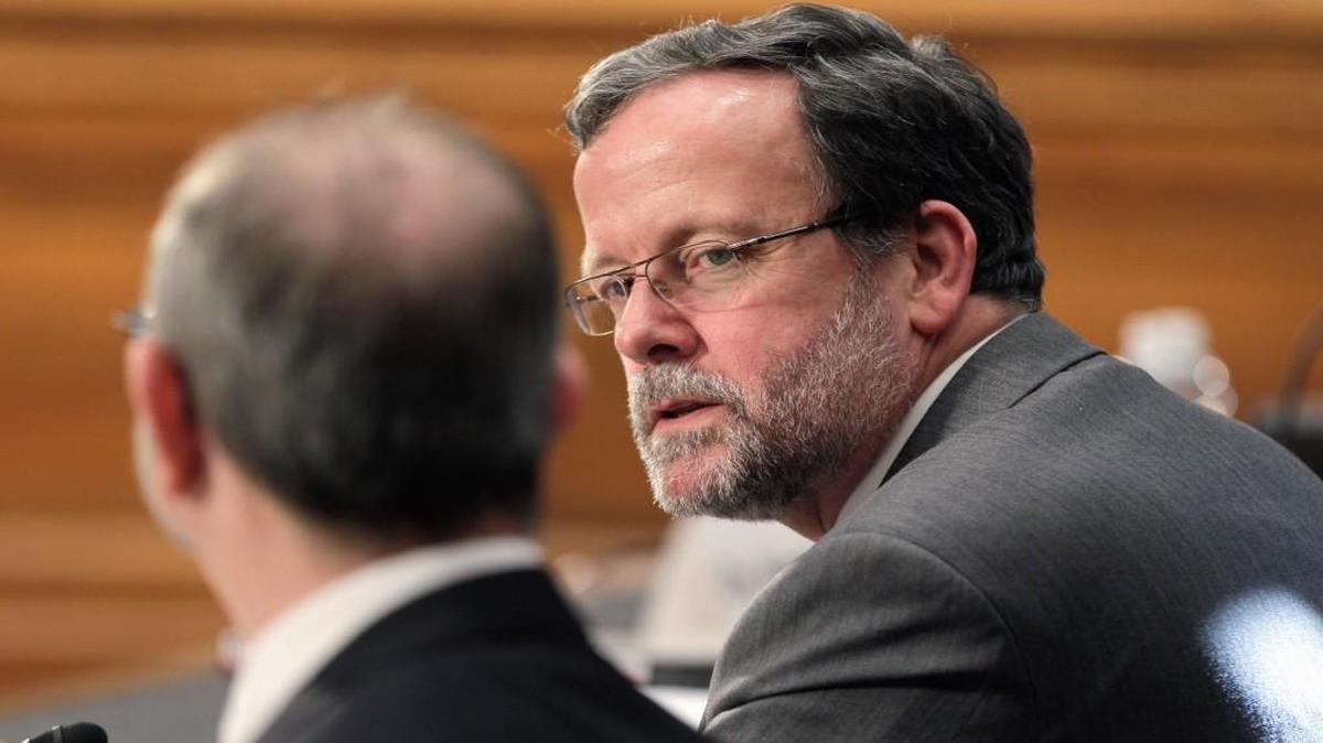 In this April 1, 2011 file photo, Keith Hall testifies on Capitol Hill in Washington. Hall became the ninth Director of the Congressional Budget Office on April 1, 2015. The nonpartisan CBO has taken a lot of abuse lately as Republicans from the White House on down have worked to discredit its inconvenient analyses of GOP health legislation.